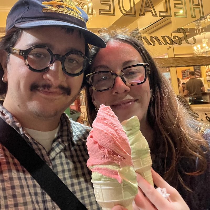 Simón and Tracy with a swirl of pink and green ice cream